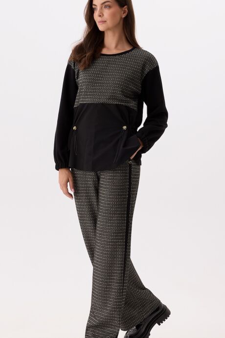 Czarno-złote spodnie z geometrycznym wzorem